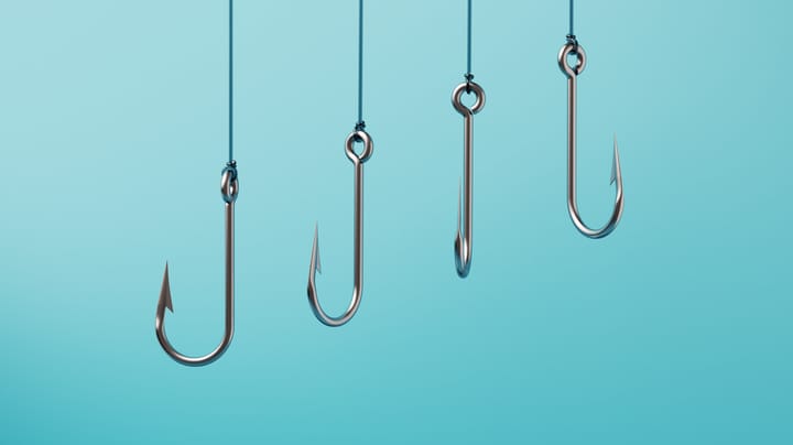 Yam Store: The Phishing Network Behind a Billion Messages 2 fishing hooks MicroStockHub GettyImages 2193660035 563wiC